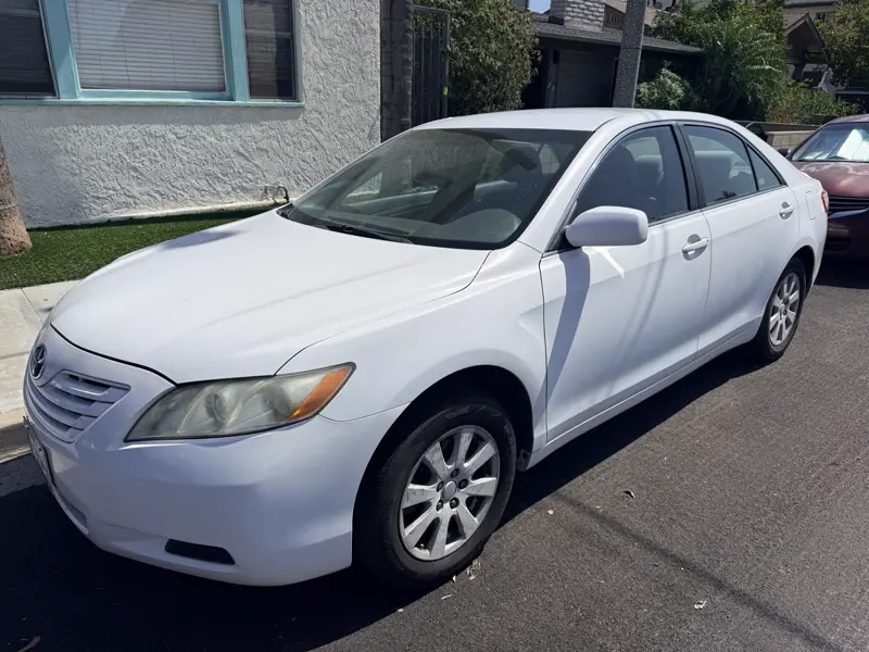 White Toyota Camry, side view